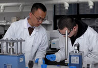 Lead author Tianyi Ma working with assistant on water batteries.