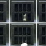 Slides of gallium Lego-like figurine melting through a tiny jail and reforming.