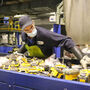 Li-Cycle employee sorting through power tool battery packs for recycling.