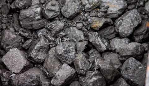 A large pile of raw, unused bituminous coal ores.