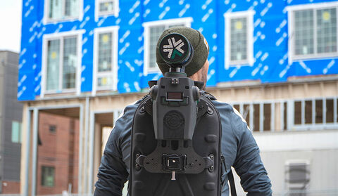 A Nexys mapping system being carried in a backpack at a construction site.
